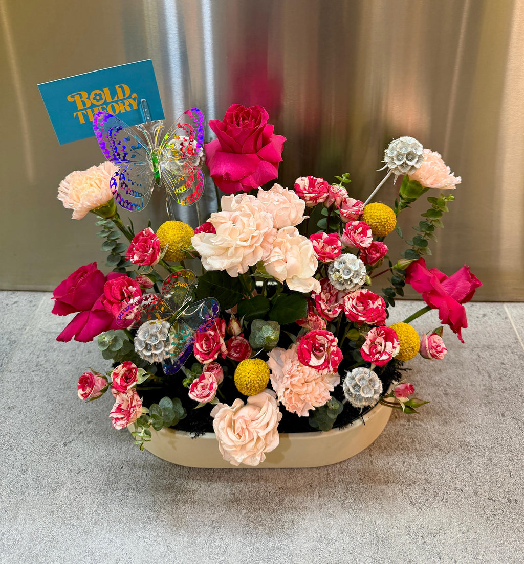 Baby Girl Butterfly Garden tray arrangement with pink flowers and butterfly accents