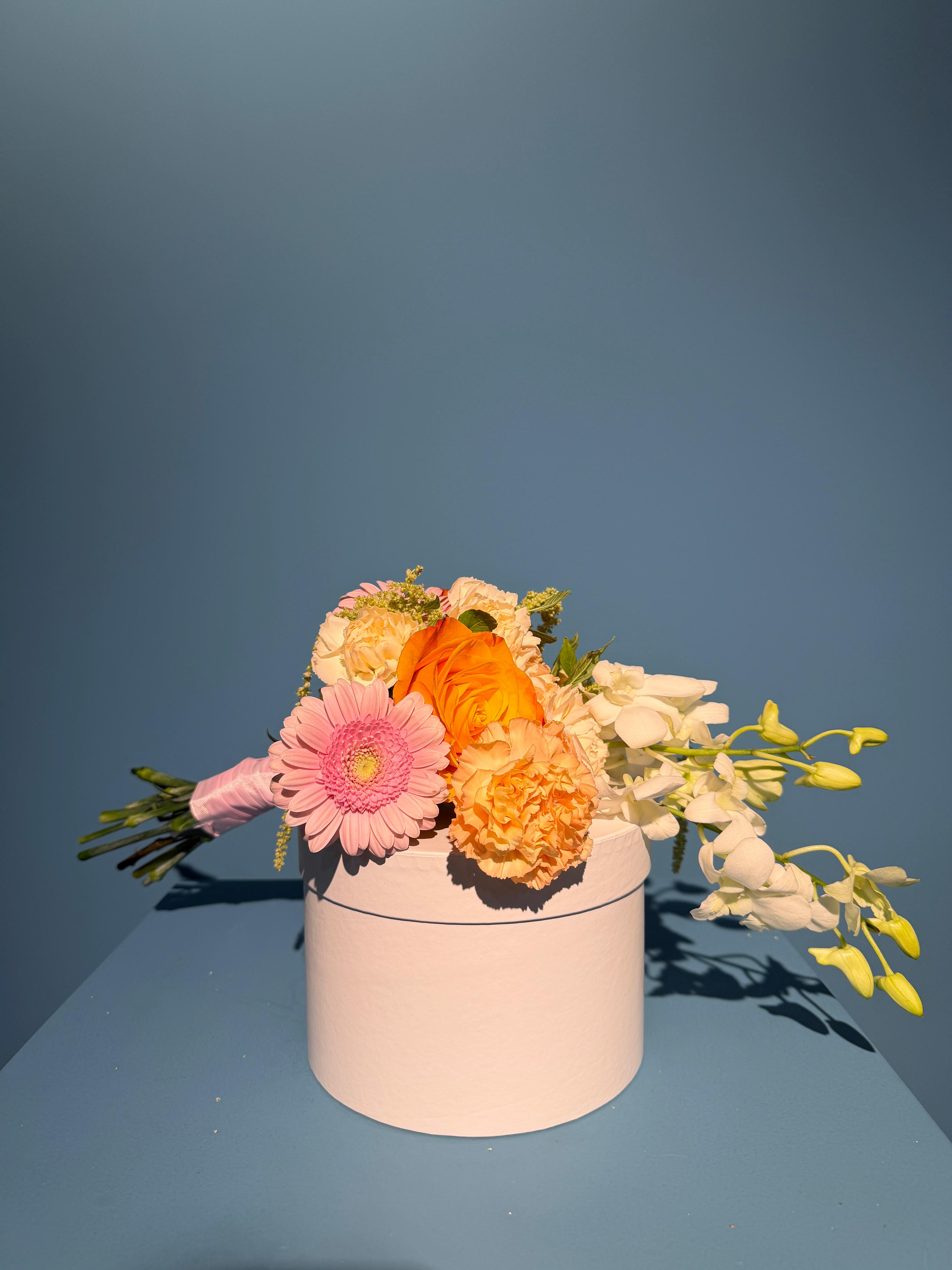 Blushing Bride bridal bouquet with pink gerbera, orchids, and blush flowers