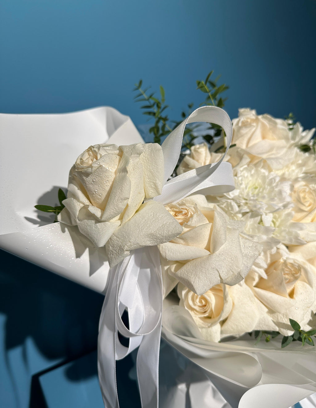Porcelain white rose bouquet with chrysanthemums and eucalyptus